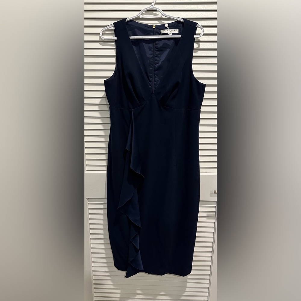 Trina Turk navy blue cocktail dress with vertical ruffle and back zipper.